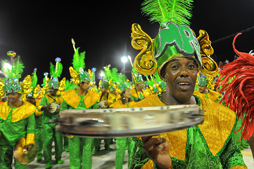 Porto Alegre, Rio Grande do Sul, Brazil - Mar 01st, 2014: Brazilian carnival musician playing tambourine on parade