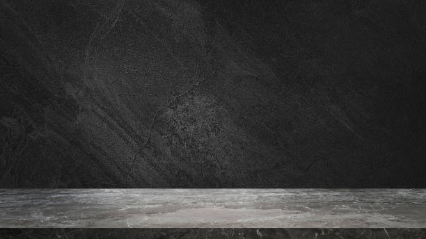 istock empty grey marble tabletop with dark black cement stone background for product displayed in rustic mood and tone. luxury background for product stand with empty copy space for party, promotion. 1481207558