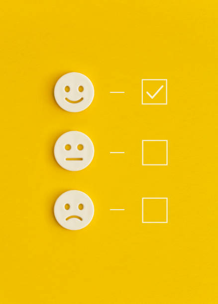 Emoticon smile on a yellow background. Customer feedback.