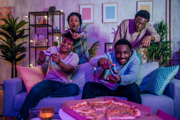 istock Excited friends playing video games at home 1481212277