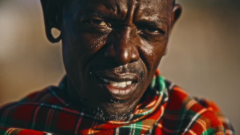 SLO MO Portrait shot of a mature man from the Samburu tribe. Documentary footage