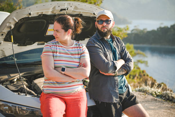 istock traveling couple arguing near a broken car 1481214034