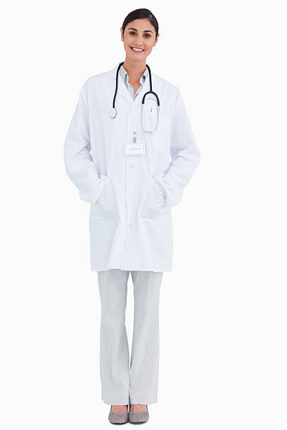 istock Smiling female doctor with hands in her pockets 148121757