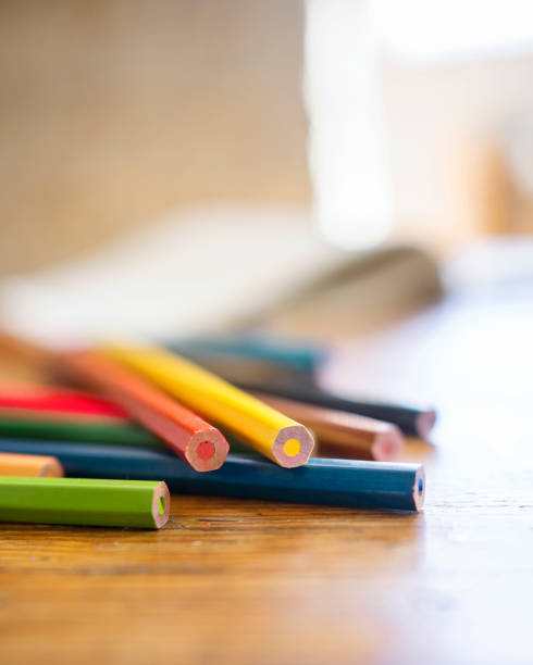 istock Assortment of multi colored pencils sitting on a table 1481217663