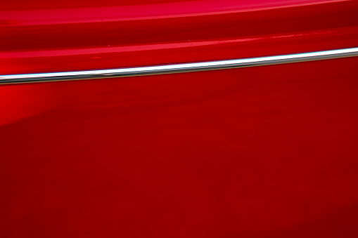 Red door of oldtimer Volkswagen car from 1960s