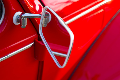 Mirror of red Volkswagen oldtimer from 1960s