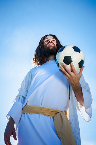 Jesus Christ playing European football (soccer).