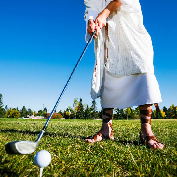 Jesus Playing Golf Jesus Christ playing golf. gladiator shoe stock pictures, royalty-free photos & images