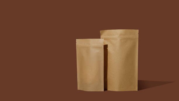 istock Brown cardboard packaging for coffee. Branding and packaging mockup for tea, coffee, snacks on a brown background 1481221401