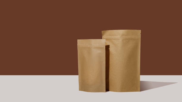 istock Brown cardboard packaging for tea. Branding and packaging mockup for tea, coffee, snacks on a brown background 1481221402