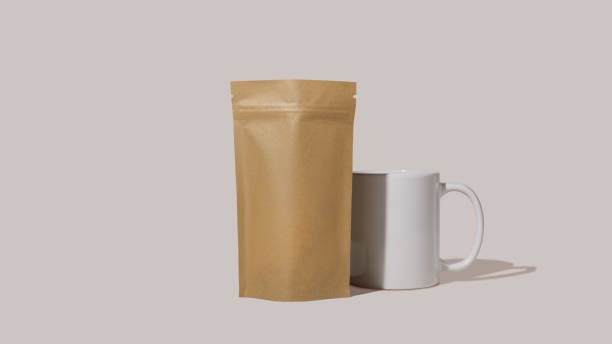 istock Brown cardboard packaging for coffee and mug. Branding and packaging mockup for tea, coffee, snacks on a pink background 1481221408