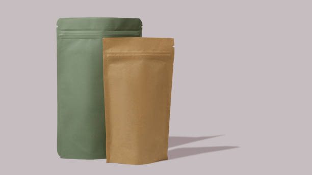 istock Green and brown cardboard packaging for tea. Branding and packaging mockup for tea, coffee, snacks on a pink background 1481221432