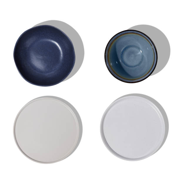 istock Handmade ceramics, empty craft ceramic plates on white background, top view 1481221450