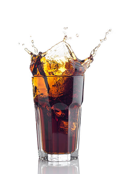 istock Glass of cola isolated on white background 148122155
