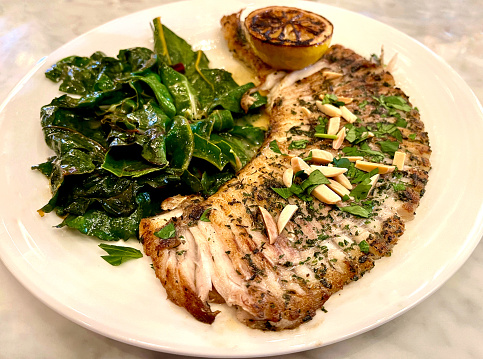 Skate wing amandine with kale and lemone