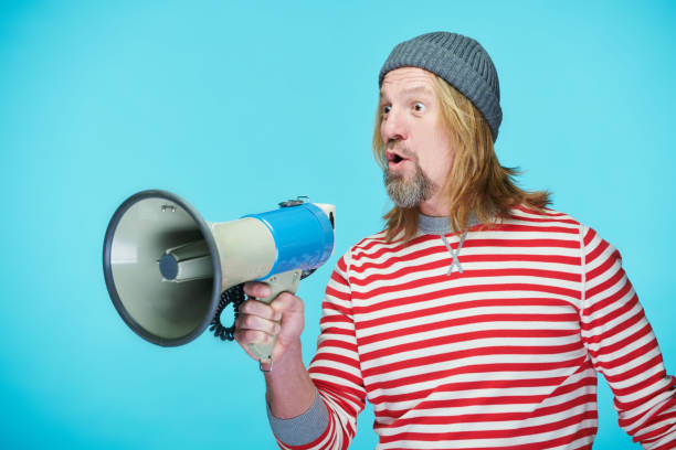istock Man announcing ad in bullhorn 1481227951