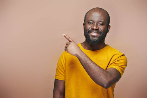 istock African American man pointing at empty space 1481230994