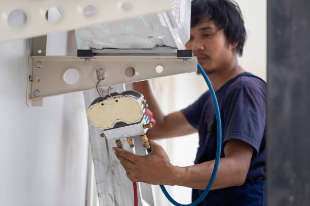 istock Young repairman fixing air conditioner unit, Asian technician man installing an air conditioning in a client house, Maintenance and repairing concepts 1481235647