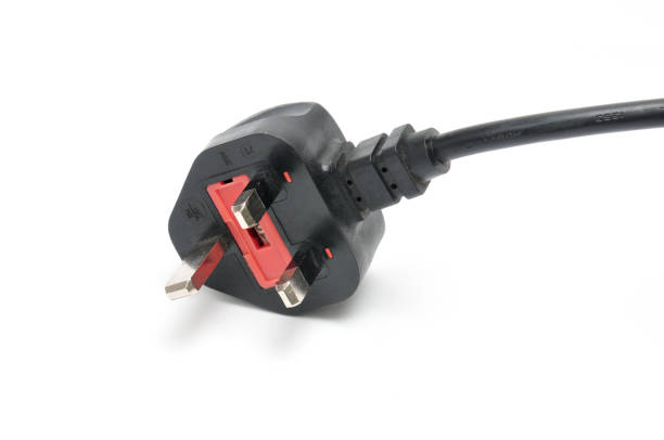 AC power plug British standard and cable on an isolated white background