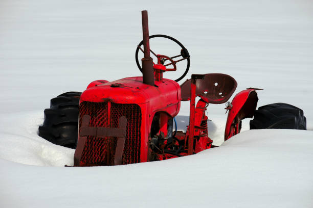 istock Old Tractor Buried in Deep Snow After Winter Storm 1481237447