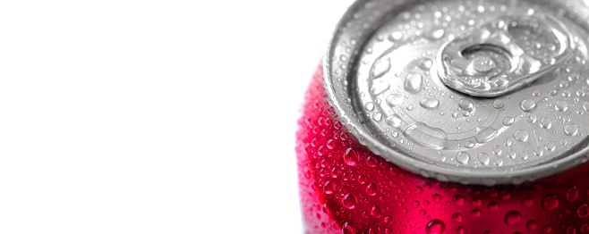 Fresh can of red soda pop soft drink with water drops chilled and refreshing cold