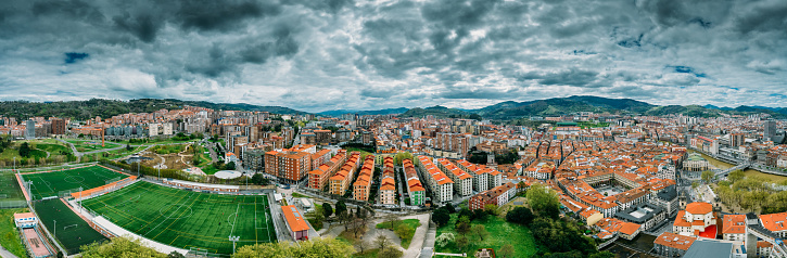 Aerial panoramic view of cloudy Bilbao, Spain from Etxebarria Park