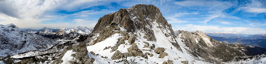 Looking out onto Sunshine Meadows, a beautiful, pristine, natural garden straddling the Continental Divide between Alberta and British Columbia at an altitude of 2,300 metres. The iconic peak of Mount Assiniboine, Simpson River Valley, Spar Mountain, Mount Shanks and lakes Laryx, Grizzly and Rock Isle are visible.