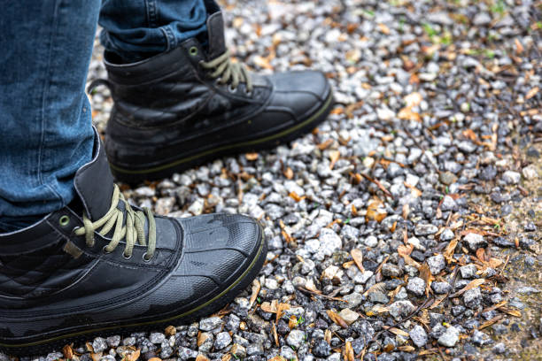 istock A man in boots stands on gravel, close up. 1481238704