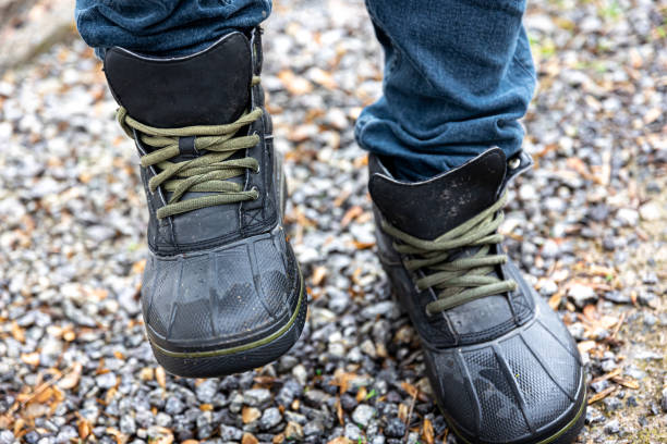 istock A man in boots stands on gravel, close up. 1481238710