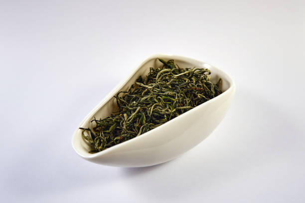 istock Dry green tea in a porcelain bowl 1481239410