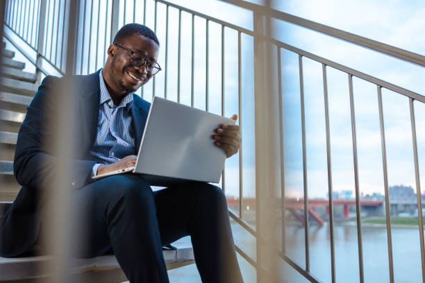 istock Young African-American businessman working using a laptop and working on a remote location 1481239541