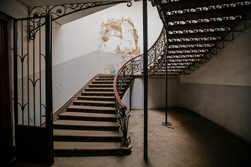 Black, cast iron staircase on exterior of Ahsan Manzil Palace.\nAhsan Manzil Museum on the banks of the Buriganga river in Dhaka, capital city of Bangladesh. The landmark building, also known as 'the pink palace' was once the seat and home of the Nuwab of Dhaka.