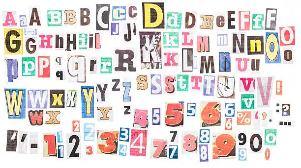 Loads of letters clipped from newspapers. There are several variants of each letter,  plus numerals and punctuation.
