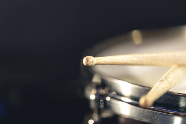 istock Close-up, snare drum and drumsticks on a dark background. 1481241065