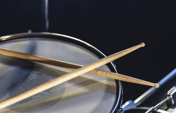 istock Close-up, snare drum and drumsticks on a dark background. 1481241073