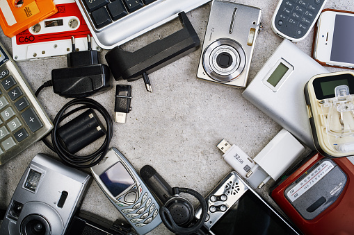 Obsolete electronic devices shaping a frame. Recycling and disposal of electronics concept