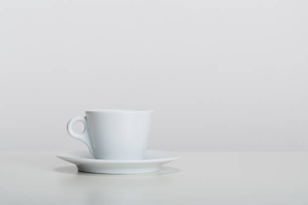istock White porcelain mic espresso coffee cup with saucer on white background, soft shadow 1481241907