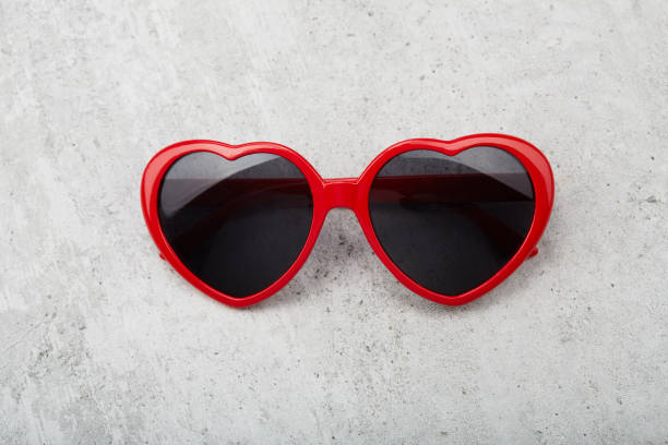 istock Red heart shape sunglasses on concrete background 1481242234