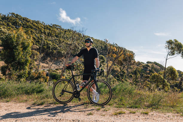 istock Young male with bicycle relaxing during training enjoying the view 1481242940