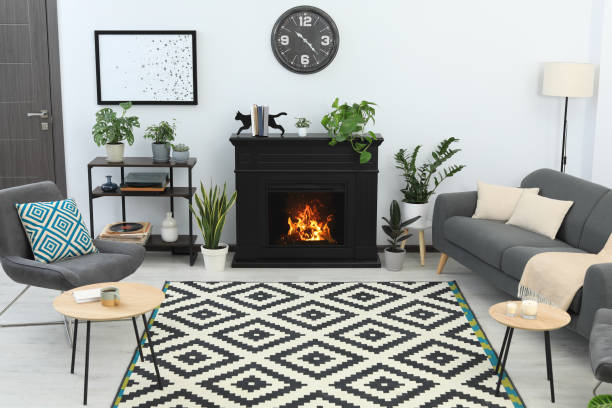 istock Stylish living room interior with fireplace and comfortable sofa 1481246183