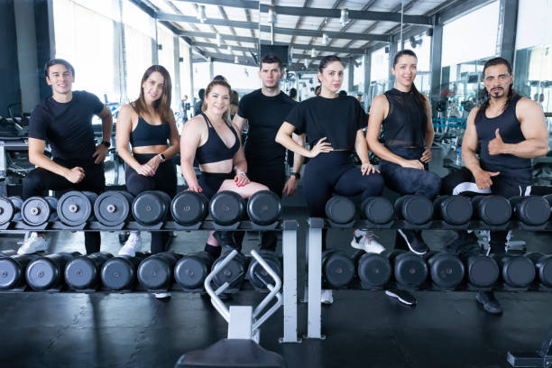 Group of instructors in the gym looking at the camera