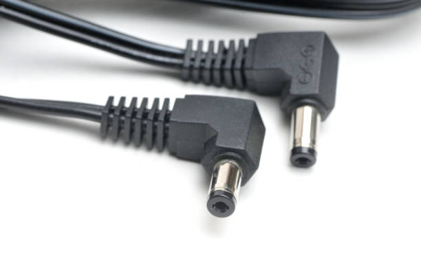 istock Cable and plug for charging video cameras, phones and other electronic devices on a white background 1481250490