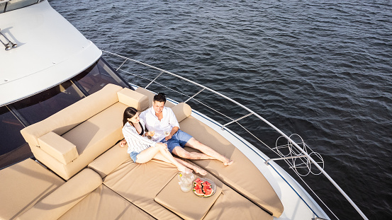 Young couple embracing on a yacht