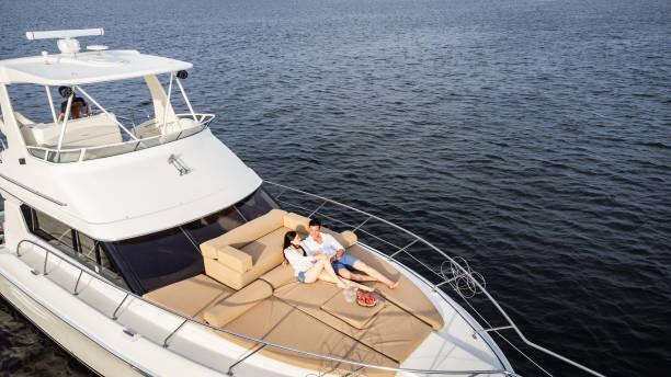 istock Young couple embracing on a yacht 1481250534