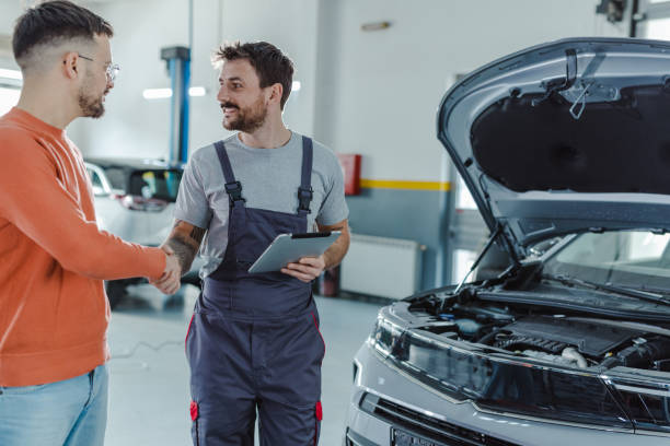istock Young man shaking hands with car mechanic 1481250622