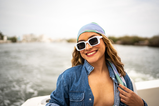 Portrait of young woman during a yacht trip