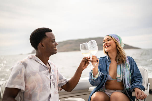istock Couple on a yacht trip doing a celebratory toast 1481251452