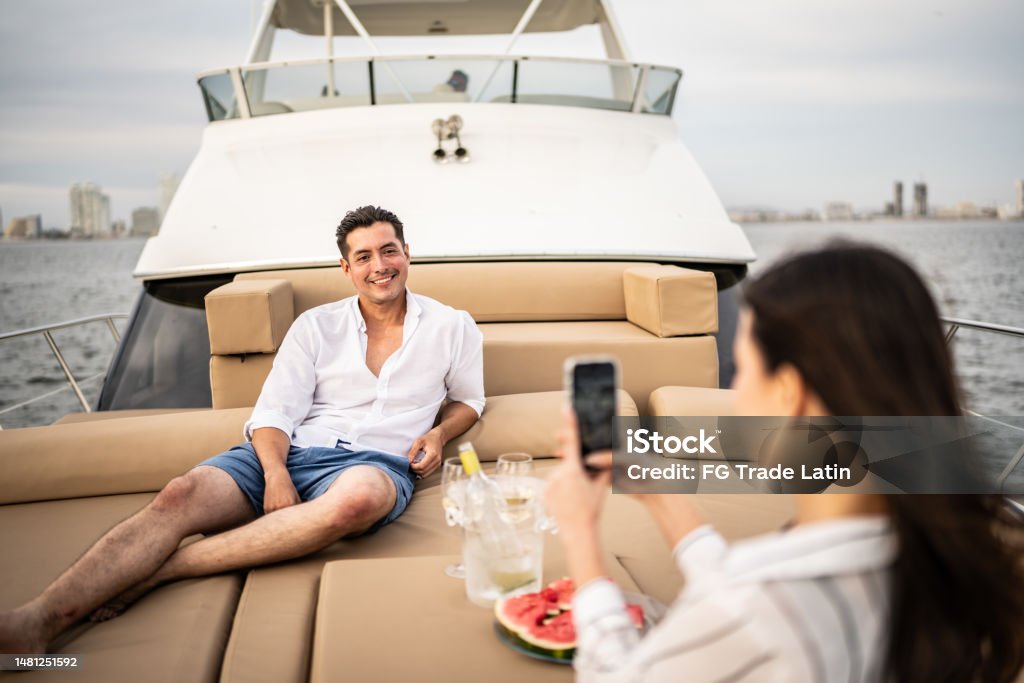 Mid adult man having his picture taken during a yacht trip Mexico Stock Photo