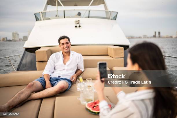 Mid Adult Man Having His Picture Taken During A Yacht Trip Stock Photo - Download Image Now