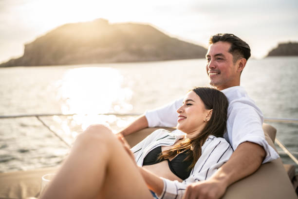 istock Young couple embracing and relaxing on a yacht 1481251711